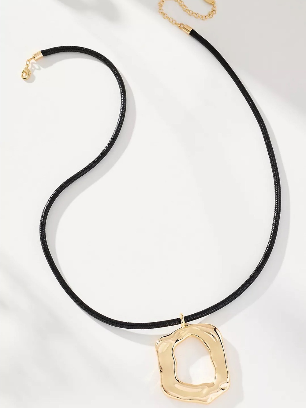 Anthropologie round gold pendant black cord necklace
